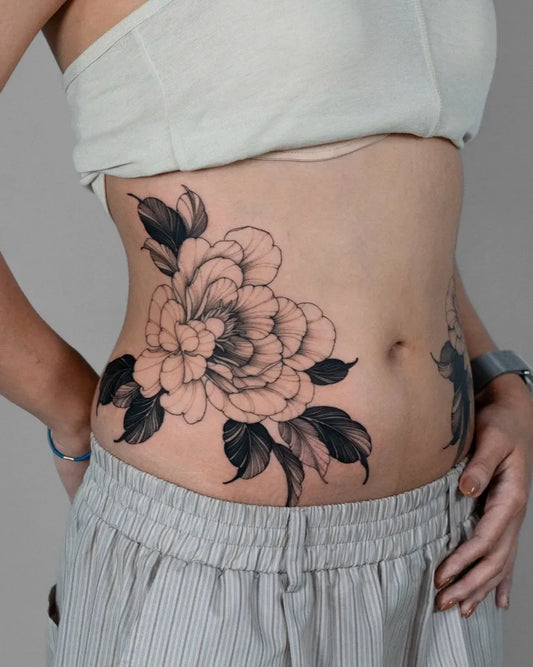 Medium Blackwork Peony and Leaves on Women Hip Tattoo by @dobby.house
