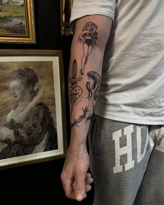Medium Blackwork Pin Up Girl Snake Barbed Wire Tattoo on Men Arm by @jerzi_ink