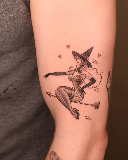 Medium Blackwork Pin Up Girl Witch Tattoo on Women Arm by @bryan