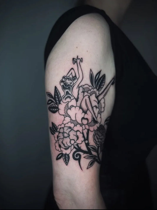 Medium Blackwork Pin Up Girl with Peonies Tattoo on Women Arm by @slowpuncture