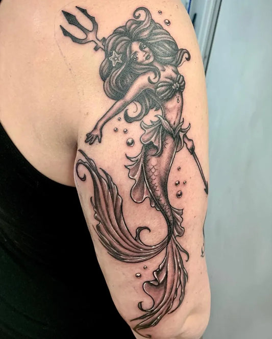 Medium Blackwork Pin Up Mermaid Tattoo on Women Arm by @paynterly.ink