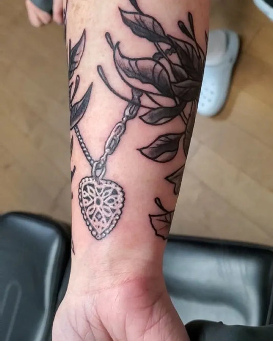 Medium Blackwork Pisces Necklace Tattoo on Women Arm by @hauntedoctopus