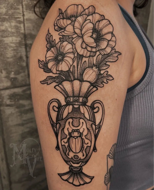 Medium Blackwork Poppy Vase Tattoo on Women Shoulder by @ladywolly