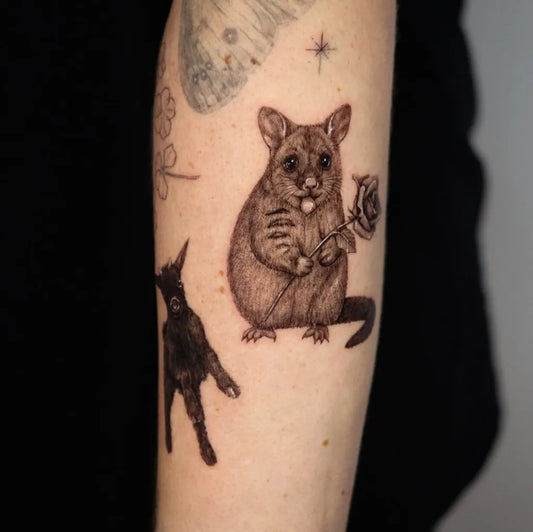 Medium Blackwork Possum and Rose Animal Tattoo on Women Arm by @kayatatt