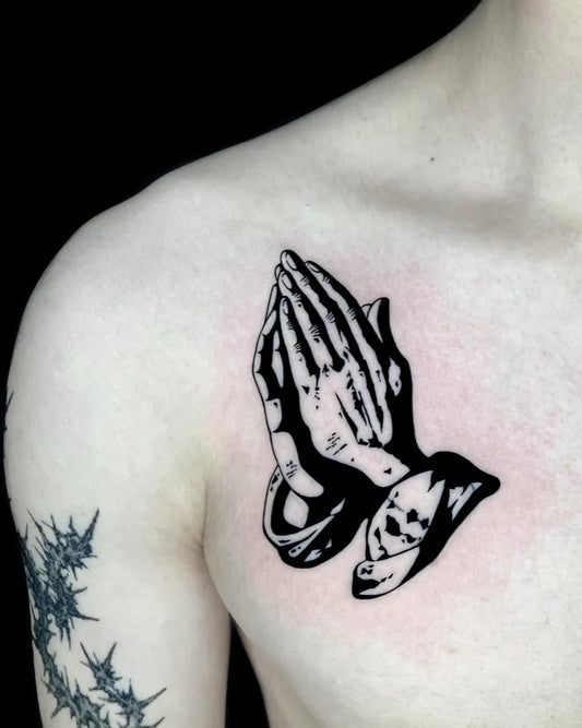 Medium Blackwork Praying Hands Tattoo on Men Chest by @xen.tattooer