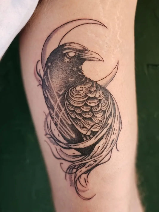 Medium Blackwork Raven and Crescent Moon on Men Arm Tattoo by @lostwoods.tattoo