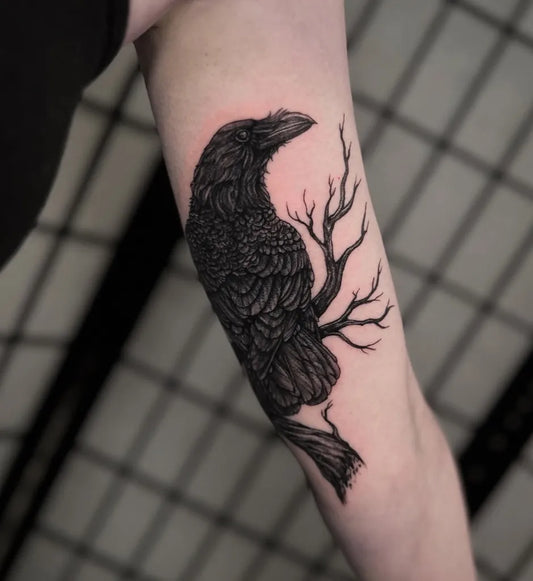 Medium Blackwork Raven with Bare Branches on Women Arm Tattoo by @solsticeink