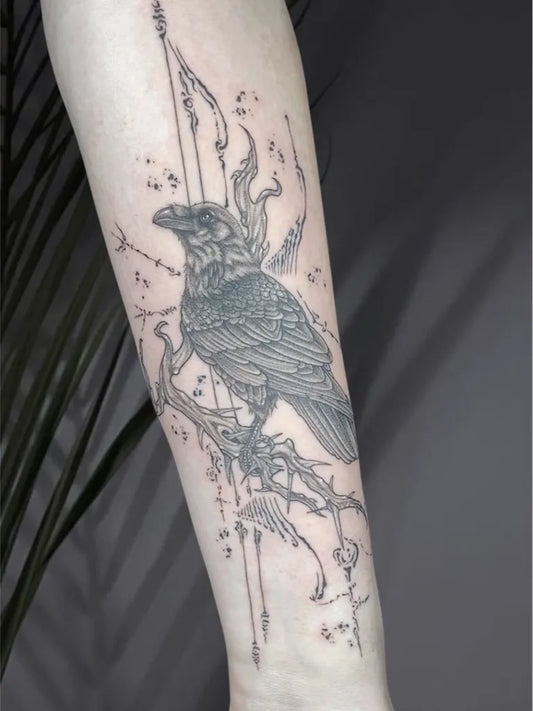Medium Blackwork Raven with Branches on Women Arm Tattoo by @catinkfacttattoo