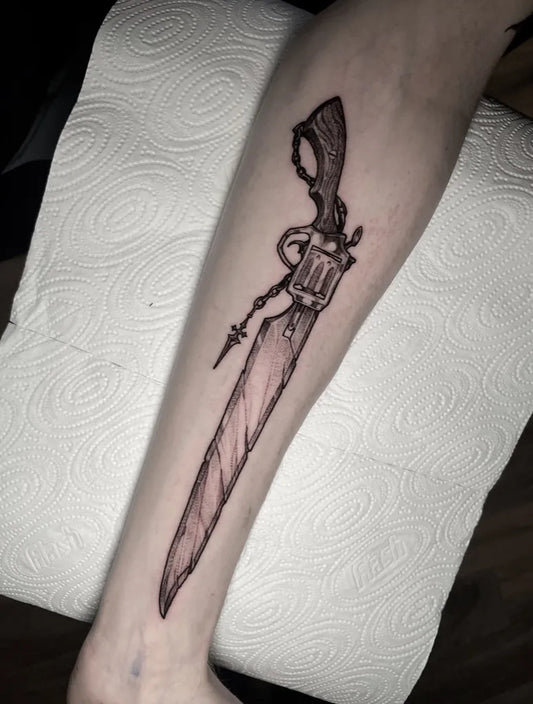 Medium Blackwork Revolver Sword on Men Arm Tattoo by @garethsandstattoo