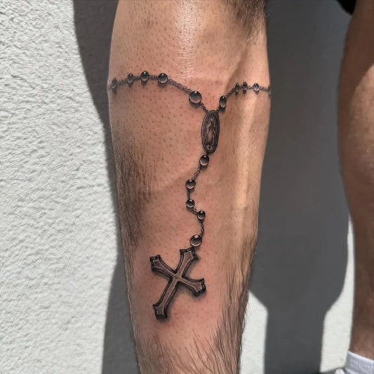 Medium Blackwork Rosary Beads Cross on Men Leg Tattoo by @macarthur.tattoos