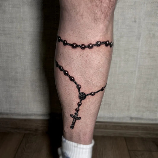 Medium Blackwork Rosary Beads and Cross on Men Leg Tattoo by @kadikoybodyart