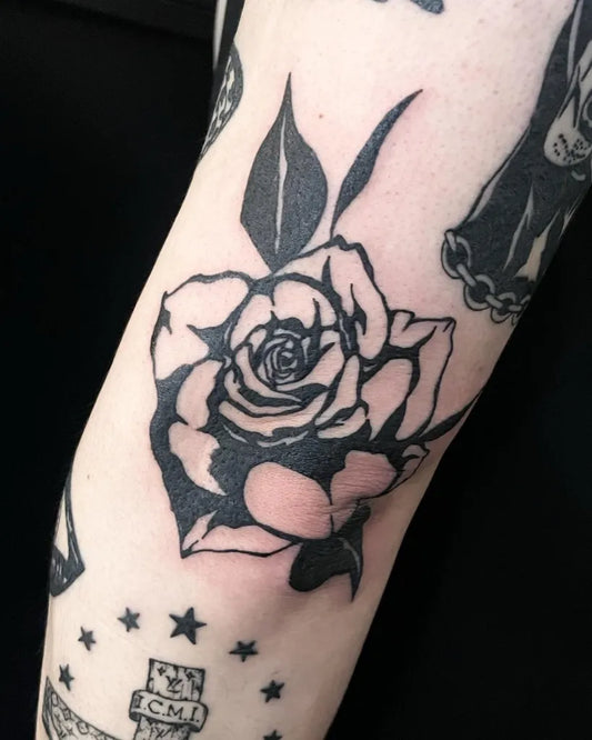 Medium Blackwork Rose Tattoo on Women Elbow by @yebel_tattooer