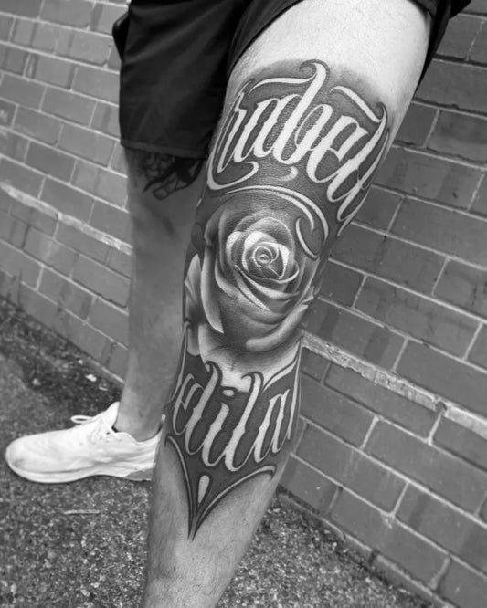 Medium Blackwork Rose and Text on Men Knee Tattoo by @all4thekauzetattoo