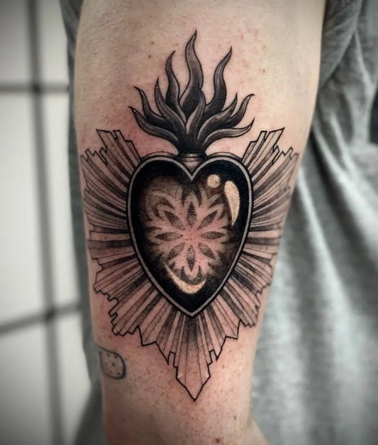 Medium Blackwork Sacred Heart Tattoo on Men Arm by @peachy_pie_tattoos