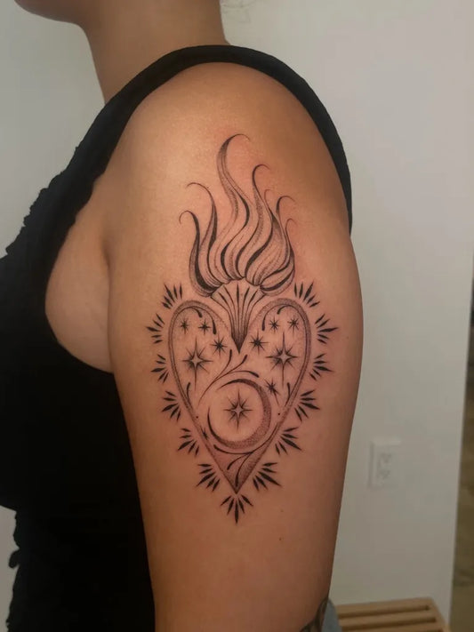 Medium Blackwork Sacred Heart Tattoo on Women Upper Arm by @raybies.ink