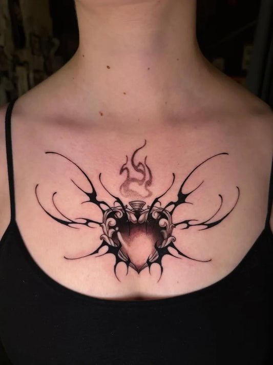 Medium Blackwork Sacred Heart Tribal Tattoo on Women Chest by @ghoul.tattoos