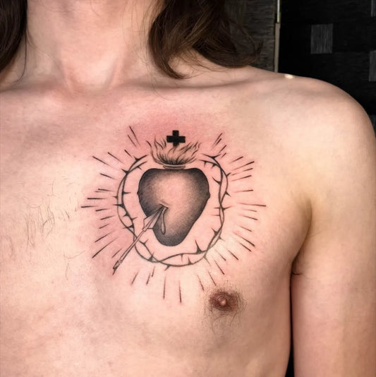 Medium Blackwork Sacred Heart with Crown of Thorns and Rays Tattoo on Men Chest by @inksbymich