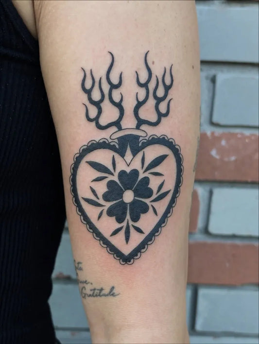 Medium Blackwork Sacred Heart with Flames Tattoo on Women Arm by @monicasilveira_art