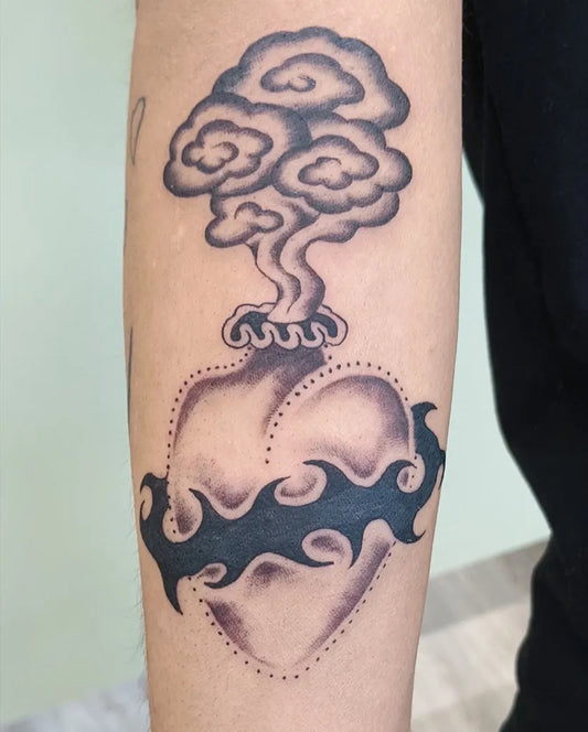 Medium Blackwork Sacred Heart with Flames and Clouds Tattoo on Men Arm by @_hello.leno_