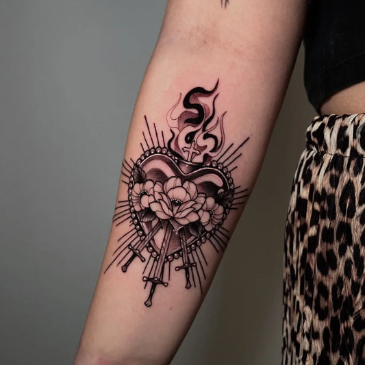 Medium Blackwork Sacred Heart with Roses and Swords Tattoo on Women Arm by @jammydrawings