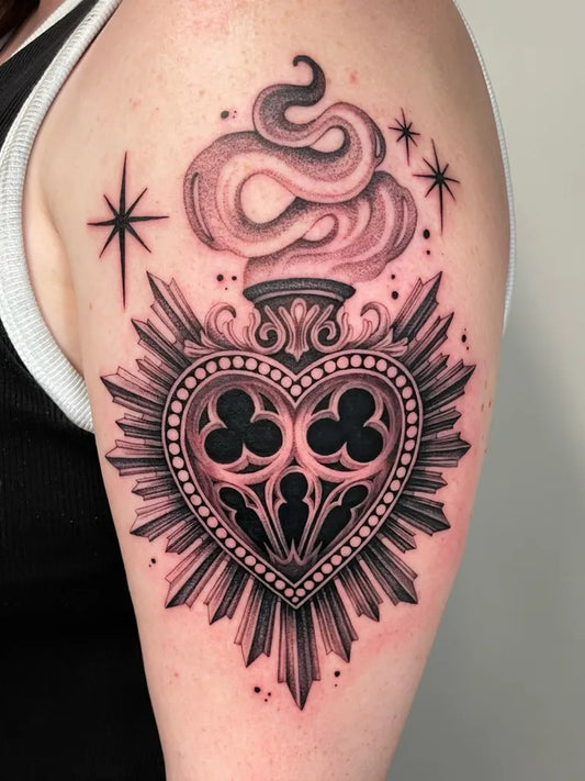 Medium Blackwork Sacred Heart with Smoke and Stars Tattoo on Women Upper Arm by @laurencoley_tattoo