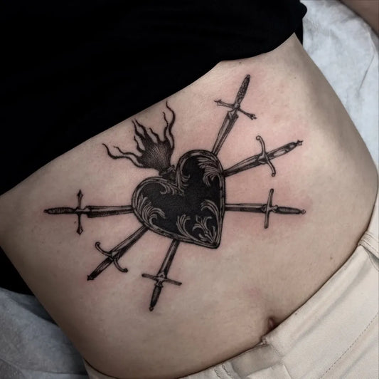 Medium Blackwork Sacred Heart with Swords Tattoo on Women Abdomen by @beccajonesart