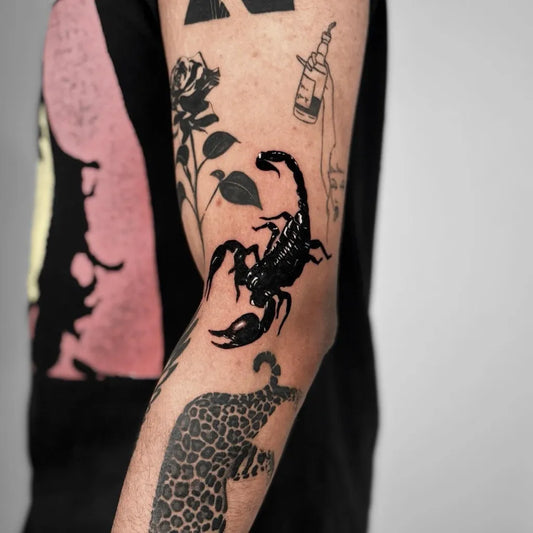 Medium Blackwork Scorpion Rose Leopard on Men Arm Tattoo by @levacktattoo