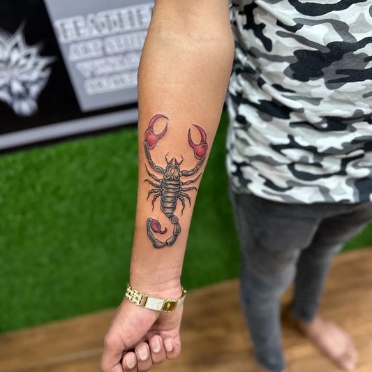 Medium Blackwork Scorpion on Men Arm Tattoo by @feather_art_studio_