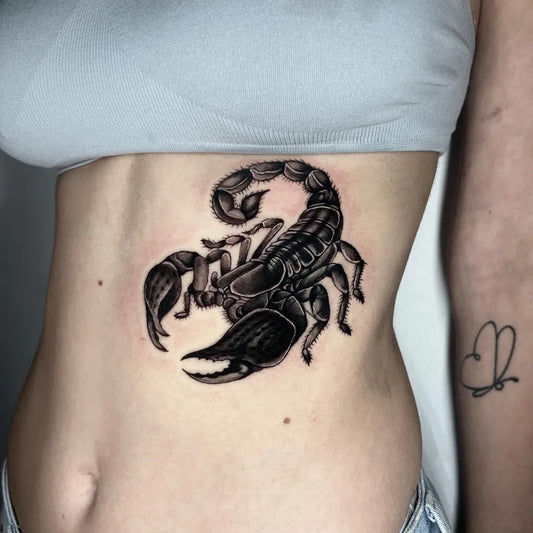 Medium Blackwork Scorpion on Women Hip Tattoo by @max_inktattoo