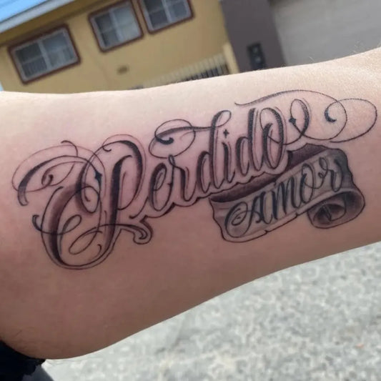 Medium Blackwork Script Banner Tattoo on Women Inner Arm by @knockout_flowerz_tattoo