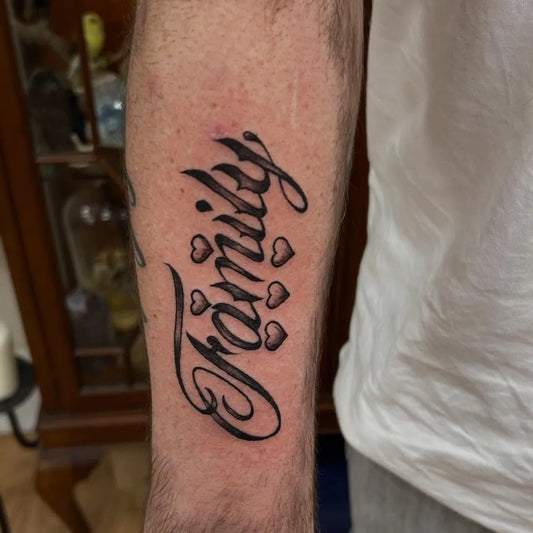 Medium Blackwork Script and Hearts Family Tattoo on Men Arm by @paganinkbysarahstreet