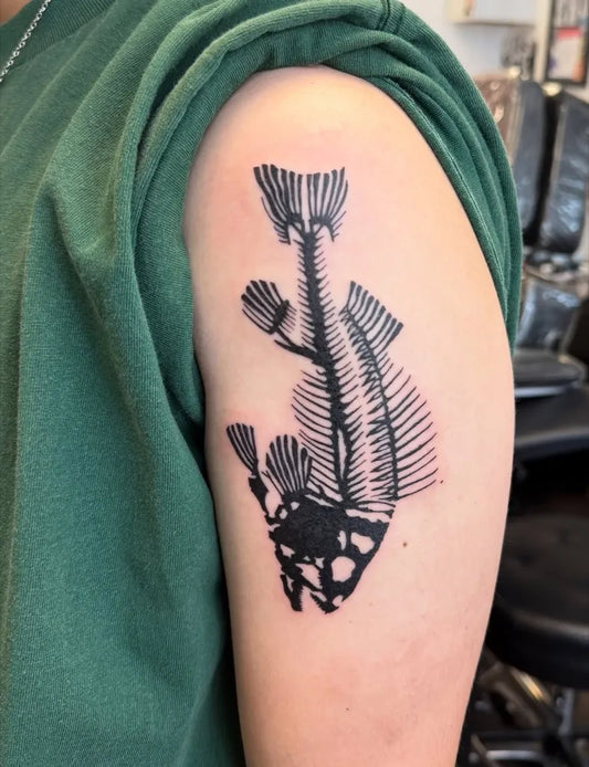 Medium Blackwork Skeleton Fish Tattoo on Men Arm by @froide.tattoo