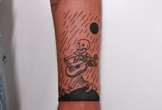 Medium Blackwork Skeleton Musician Tattoo on Men Arm by @chickpeatattoos