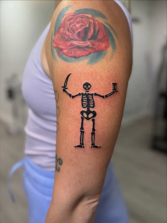 Medium Blackwork Skeleton Rose Tattoo on Women Shoulder by @h8n_tattoo.studio