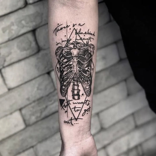 Medium Blackwork Skeleton Text Tattoo on Men Chest by @tattoobullstudio