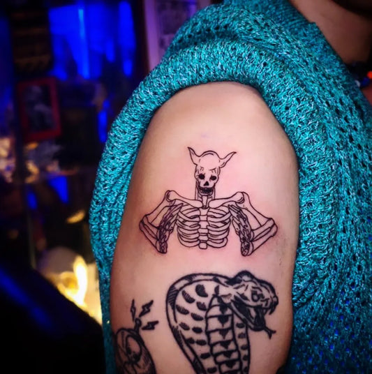 Medium Blackwork Skeleton and Snake Tattoo on Women Arm by @bubble_brain_tattoo
