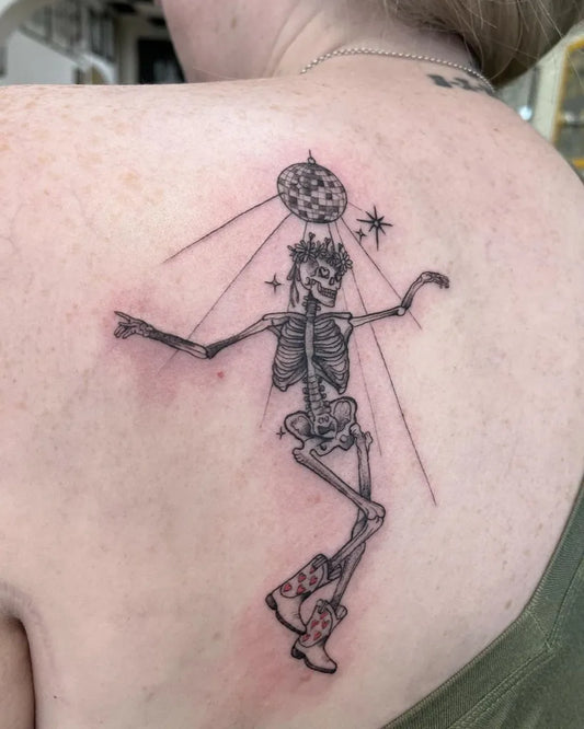 Medium Blackwork Skeleton with Disco Ball Tattoo on Women Shoulder by @kirstiemarshalltattoo