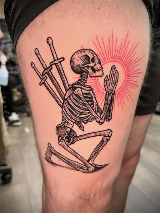 Medium Blackwork Skeleton with Swords and Sun Tattoo on Men Thigh by @angryface.tattoo