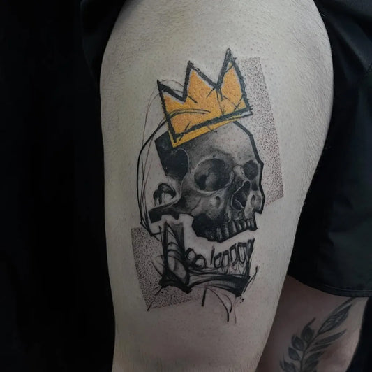 Medium Blackwork Skull Crown Banner on Men Thigh Tattoo by @unclearlotattooer