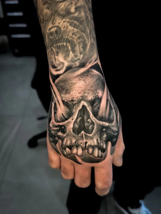 Medium Blackwork Skull Flames on Men Hand Tattoo by @mrbttattoo