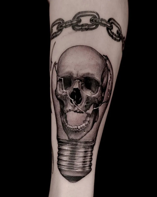Medium Blackwork Skull Lightbulb Chains on Men Arm Tattoo by @o_one_art