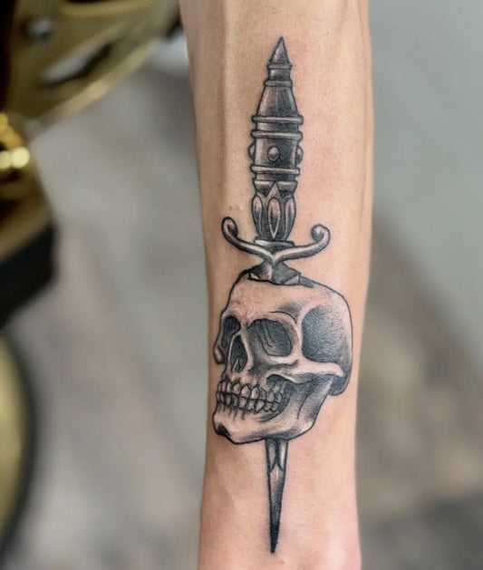 Medium Blackwork Skull and Dagger on Men Arm Tattoo by @pantelis__kyr