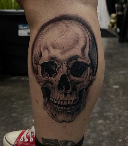 Medium Blackwork Skull on Men Leg Tattoo by @cginks