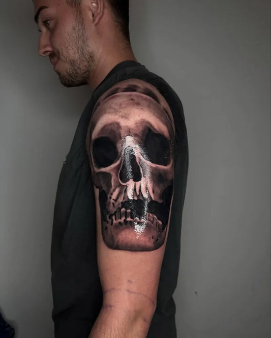 Medium Blackwork Skull on Men Shoulder Tattoo by @emil.tattoo_