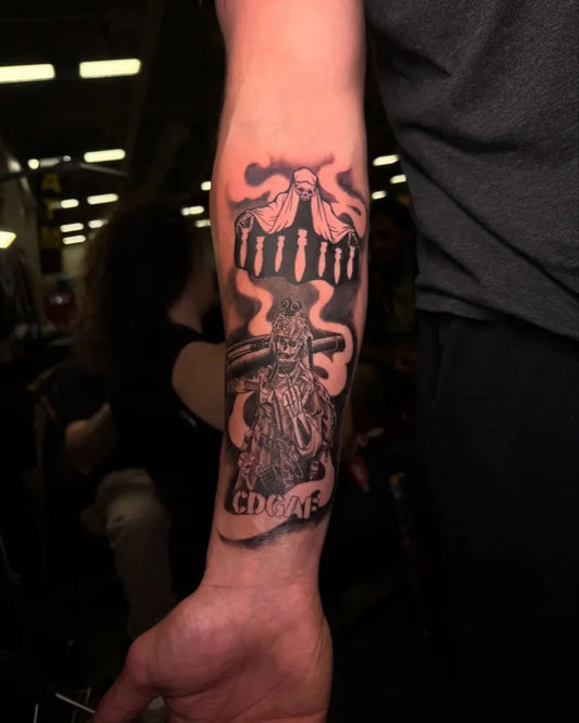 Medium Blackwork Skull with Bones and Smoke Military Tattoo on Men Arm by @rootattoos