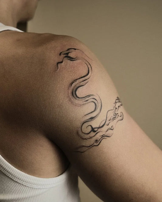 Medium Blackwork Snake Cloud Tattoo on Men Shoulder by @dor.llhpoke