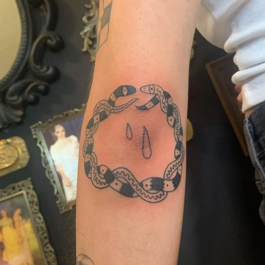 Medium Blackwork Snake Ring Tattoo on Women Elbow by @yomaddo