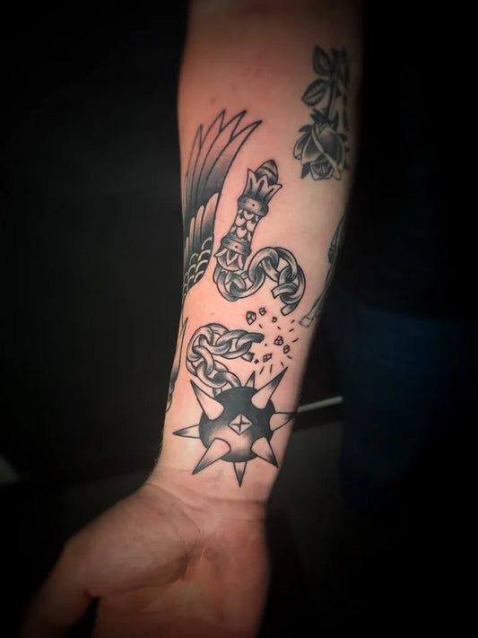 Medium Blackwork Snake and Mace Tattoo on Men Arm by @tattoosbymago