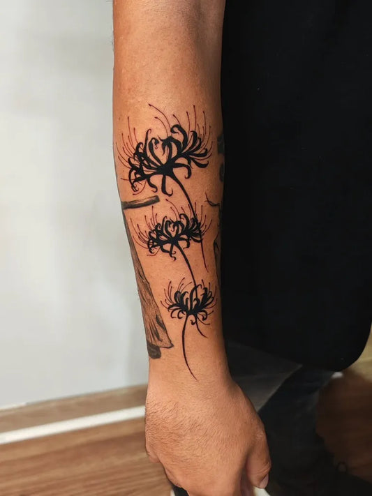 Medium Blackwork Spider Lily Tattoo on Men Arm by @hirog_tattoo