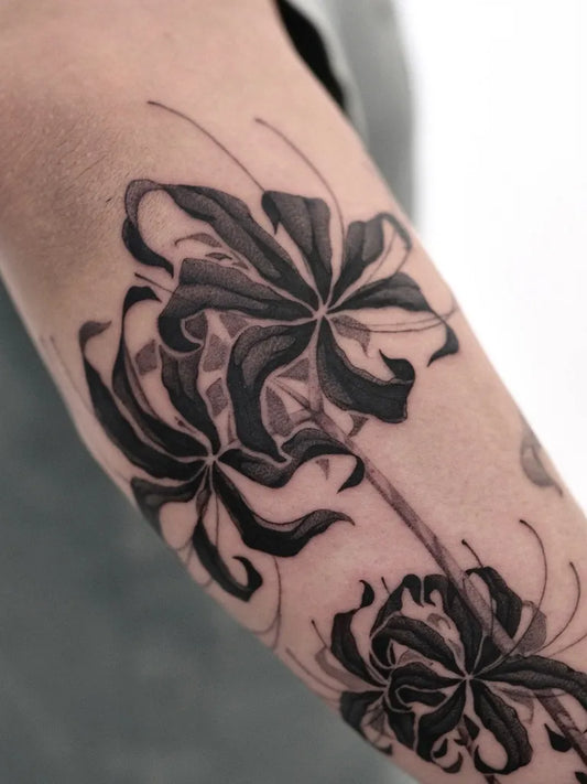 Medium Blackwork Spider Lily Tattoo on Women Arm by @delicz.ttt